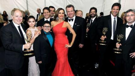 The cast and crew of Modern Family pose backstage after winning the award for outstanding comedy series at the 63rd Primetime Emmy Awards on Sunday, Sept. 18, 2011 in Los Angeles. (AP Photo/Matt Sayles)