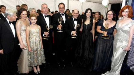 The cast and crew of Mad Men pose backstage after winning the award for outstanding drama series at the 63rd Primetime Emmy Awards on Sunday, Sept. 18, 2011 in Los Angeles. (AP Photo/Matt Sayles)