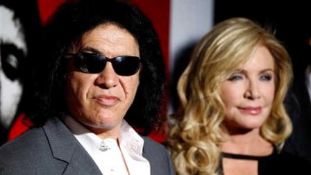 FILE - In this Aug. 23, 2011 file photo, Gene Simmons, left, and Shannon Tweed arrive at the Scarface Legacy Celebration Event in Los Angeles. Rocker Gene Simmons and his longtime girlfriend, actress Shannon Tweed, have tied the knot Saturday Oct. 1, 2011. People magazine reported the couple exchanged vows they wrote themselves. The magazine said about 400 guests attended the Saturday evening ceremony outside a Beverly Hills hotel.