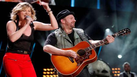 Jennifer Nettles, left, and Christian Bush of Sugarland perform during the CMA Fan Festival Friday, June 10, 2011 in Nashville, Tenn.