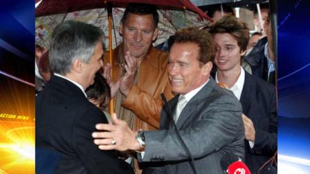 Austrian-born actor and former Californian governor, Arnold Schwarzenegger, right, is welcomed by Austrian chancellor Werner Faymann, left, while German actor Ralf Moeller, center, applauds prior to the inauguration of a museum in the house of Schwarzeneggers birth in Thal near Graz, Austria Friday Oct. 7, 2011.