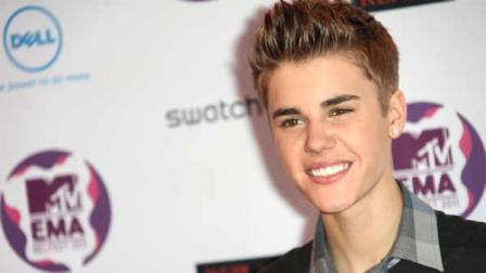 Singer Justin Bieber poses on the red carpet at the MTV European Music Awards 2011, in Belfast, Northern Ireland Sunday, Nov. 6, 2011.
