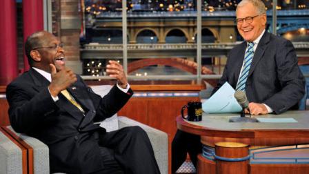 In this photo provided by CBS, Republican presidential candidate Herman Cain joins host David Letterman on the set of the Late Show with David Letterman, Thursday, Nov. 17, 2011 in New York. The show airs Friday, Nov. 18. (AP Photo/CBS, John Paul Filo)