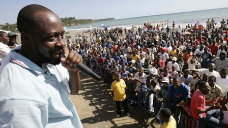Haitian-born hip-hop musician Wyclef Jean speaks to the crowd at the site of his upcoming concert in Jacmel a small southeastern port city 110 miles from Port-au-Prince, Haiti, Thursday, Nov. 30, 2006. Wyclef will hold a concert in Haiti tomorrow.