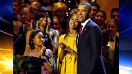 Sasha Obama, left, first lady Michelle Obama, Malia Obama, and President Barack Obama, are seen on stage at the annual Christmas in Washington taping at the National Building Museum in Washington, Sunday, Dec. 11, 2011. (AP Photo/Jacquelyn Martin)