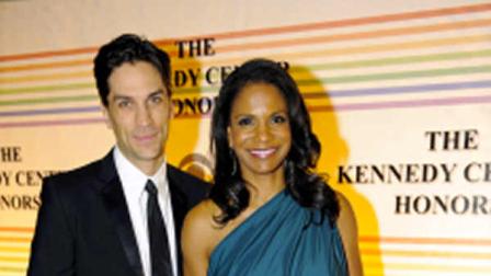 FILE - In this Dec. 4, 2011 file photo, actress Audra McDonald, right, and actor Will Swenson arrive at the Kennedy Center for the Performing Arts for the Kennedy Center Honor gala performance in Washington. McDonald, who currently stars on Broadway in Porgy and Bess, and Swenson, who plays Tick in Priscilla Queen of the Desert: The Mudsical, were engaged on New Years Day. (AP Photo/Kevin Wolf, file)