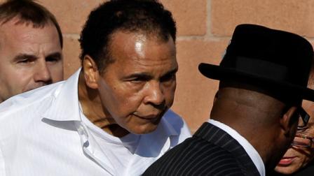 FILE -In this Nov. 14, 2011 file photo, former boxing champion Muhammad Ali leaves after a memorial service for boxing legend Joe Frazier at the Enon Tabernacle Baptist Church in Philadelphia. (AP Photo/Matt Slocum, File)