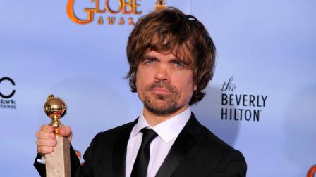 Actor Peter Dinklage poses backstage with the award for Best Supporting Actor in a Series, Mini Series or TV Movie for Game of Thrones during the 69th Annual Golden Globe Awards Sunday, Jan. 15, 2012, in Los Angeles.