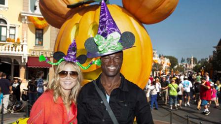 In this image released by Disney, model and TV personality Heidi Klum, left, and her husband, singer Seal, pose at Halloween Time at Disneyland in Anaheim, Calif., on Thursday, Sept. 29, 2011. The Halloween Time celebration, which features special attractions and entertainment, continues through Oct. 31. (AP Photo/Disneyland, Paul Hiffmeyer)