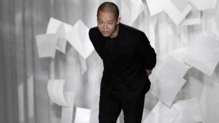 Designer Jason Wu takes a bow after presenting his Spring 2012 collection Friday, Sept. 9, 2011, during Fashion Week in New York. (AP Photo/Mary Altaffer)