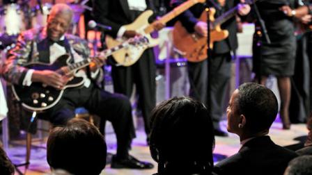 President Barack Obama and first lady Michelle Obama, center, listen as B.B. King, left, and others perform during the White House Music Series saluting Blues Music in recognition of Black History Month, Tuesday, Feb. 21, 2012, in the East Room of the White House in Washington. (AP Photo/Pablo Martinez Monsivais)