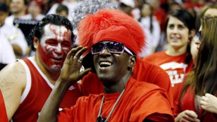 Flavor Flav joins the UNLV student section during an NCAA college basketball game against San Diego State on Saturday, Feb. 11, 2012, in Las Vegas. (AP Photo/Isaac Brekken)