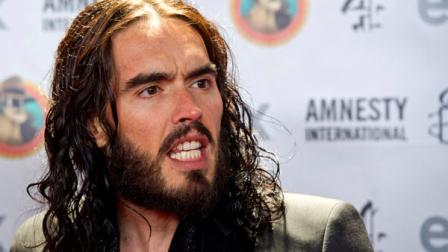 FILE - In this March 4, 2012 file photo, Russell Brand arrives to Amnesty Internationals Secret Policemans Ball in New York. New Orleans police have issued an arrest warrant for actor Russell Brand on a charge of simple criminal damage to property valued at $700. (AP Photo/Charles Sykes, file)