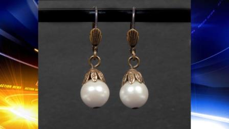 This undated photo provided by Juliens Auctions shows a pearl drop earrings worn by Whitney Houston in The Bodyguard and which sold for $2,812 at an auction in Beverly Hills of memorabilia from the late pop stars career on Saturday, March 31, 2012, in Beverly Hills, Calif. (AP Photo/Juliens Auctions)