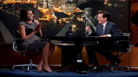 In this photo provided by Comedy Central, first lady Michelle Obama laughs with Stephen Colbert during her appearance on Comedy Centrals The Colbert Report in New York. Obama has been everywhere from a West Point mess hall to a NASCAR speedway in the past year to drum up support for military families through her joining forces campaign. On Wednesday, she marked the programs one-year anniversary by taking stock of whats been done and challenging Americans to do even more. (AP Photo/Comedy Central, Kristopher Long)