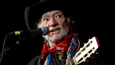 FILE - Willie Nelson takes the stage during Fire Relief, The Concert For Central Texas at the Frank Erwin Center in Austin, Texas, in this Oct. 17, 2011 file photo. Country music legend Willie Nelson was expected to help unveil an eight-foot statue of himself in downtown Austin on Friday April 20, 2012, which happens to be a national day of protest for the legalization of marijuana. (AP Photo/Erich Schlegel, File)