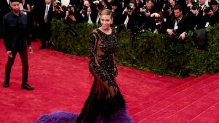 Beyonce arrives at the Metropolitan Museum of Art Costume Institute gala benefit, celebrating Elsa Schiaparelli and Miuccia Prada, Monday, May 7, 2012 in New York. (AP Photo/Charles Sykes)