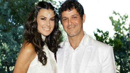 In this photo, taken Saturday, May 26, 2012 and released by Rondene Public Relations Tuesday, May 29, 2012, newlyweds Alejandro Sanz and Raquel Perera pose for a photo at an undisclosed location in Spain. The couple were married in a religious ceremony in Barcelona on Wednesday, May 23, 2012 and then renewed their vows on Saturday, coinciding with the christening of his son, Dylan. (AP Photo/Rondene Public Relations)