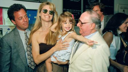 Singer Billy Joel, left, his wife Christie Brinkley and daughter Alexa Ray celebrate with Christies father Don Brinkley, right, as he is honored by the Museum of Public Broadcasting Monday, June 27, 1988 in New York for his work as a television writer/producer. (AP Photo/Mario Suriani)