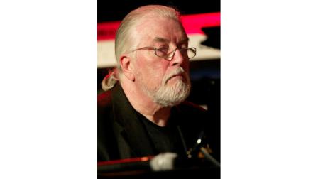 FILE - In this file picture dated Tuesday, Oct. 5, 2004 shows British musician Jon Lord plays piano during a test run for his concert in Cologne, western Germany. Deep Purples Jon Lord, died aged 71, Monday, July 16, 2012. The Leicester-born keyboard player, who had pancreatic cancer, died in London today. (AP Photo/Hermann J. Knippertz,File)