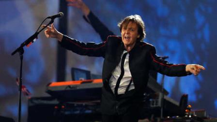 Paul McCartney performs during the Opening Ceremony at the 2012 Summer Olympics, Saturday, July 28, 2012, in London. (AP Photo/Matt Dunham, Pool)