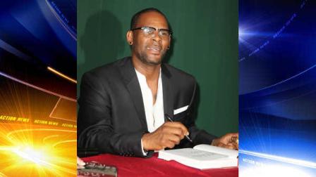 Friday, Aug. 10, 2012 photo released by Starpix shows R&B singer R. Kelly signing copies of his memoir, Soulacoaster: The Diary of Me, at Barnes and Noble in New York. (AP Photo/Starpix, Amanda Schwab)