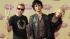 Members of Green Day, from left, Tre Cool,...