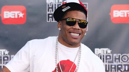 FILE - This Oct. 1, 2011 file photo shows rapper Nelly arriving for the BET Hip Hop Awards in Atlanta. Authorities say they found drugs and a gun on rapper Nellys tour bus at a West Texas border checkpoint where several celebrities have been arrested. Hudspeth County sheriffs officials said an initial search Wednesday, Oct. 10, 2012, turned up small amounts of marijuana and heroin and a loaded gun. Authorities say a second search revealed a duffel bag with about 10 pounds of pot. (AP Photo/David Goldman, file)