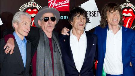 From left, Charlie Watts, Keith Richards, Ronnie Wood and Mick Jagger, from the British Rock band, The Rolling Stones, arrive at a central London venue, to mark the 50th anniversary of the Rolling Stones first performance, Thursday, July 12, 2012. (AP Photo/Jonathan Short)