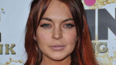 FILE - Lindsay Lohan attends the Mr. Pink Ginseng launch party at the Beverly Wilshire hotel on Thursday, Oct. 11, 2012, in Beverly Hills, Calif. (Photo by Richard Shotwell/Invision/AP)