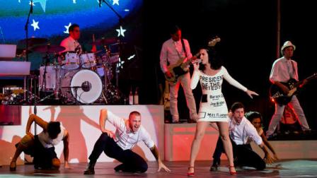 Singer Katy Perry performs for a crowd before the arrival of President Barack Obama at a campaign rally, Wednesday, Oct. 24, 2012, in Las Vegas. (AP Photo/Julie Jacobson)