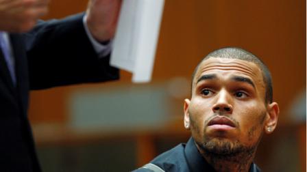 R&B singer Chris Brown, right, appears in court court with his attorney Mark Geragos for a probation progress report hearing in Los Angeles Thursday, Nov. 1, 2012. Brown remains on supervised probation for felony assault for an attack on Rihanna in 2009. He is scheduled to return to court Jan. 17. A California judge says Chris Brown must return to court to update her on the progress of his probation after he completes an overseas tour. (AP Photo/David McNew, Pool)