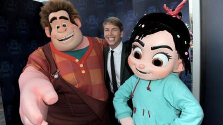 FILE - In this Mon., Oct. 29, 2012 file photo, Jack McBrayer poses with characters Wreck-It Ralph, left, and Vanellope von Schweetz at the world premiere of Wreck-It Ralph at El Capitan Theatre, in Los Angeles. McBrayer voices the character Fix-It Felix in the film that opened on Nov. 2. (Photo by Jordan Strauss/Invision/AP, File)