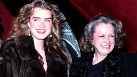 Famous model and actress Brooke Shields and her mother, Teri, right, smile Feb.4,1989 as they arrive to attend the premier of the restored version of the film Larence of Arabia in New York City. (AP Photo/Mark Lennihan)