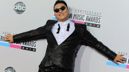 PSY arrives at the 40th Anniversary American Music Awards on Sunday, Nov. 18, 2012, in Los Angeles. (Photo by Jordan Strauss/Invision/AP)