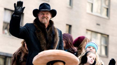 FILE - In this Thursday, Nov. 22, 2012 file photo, Trace Adkins rides a float in the Macys Thanksgiving Day Parade in New York. Trace Adkins wore an earpiece decorated like the Confederate flag when he performed for the Rockefeller Center Tree Lighting on Nov. 28, but he said he didnt mean to offend anyone by wearing it. (AP Photo/Charles Sykes, File)
