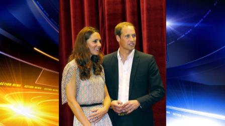 Prince William and his wife Kate, the Duke and Duchess of Cambridge, smile on stage following a performance at Rainbow Centre, a school for disabled children in Singapore.