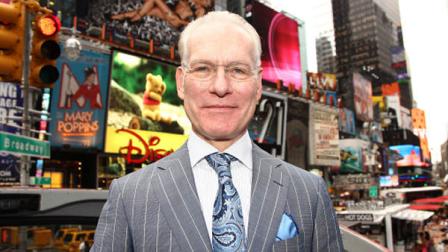 FILE - This July 19, 2012 file photo shows host Tim Gunn poses for a photo while promoting the launch of the new season of Project Runway in New Yorks Times Square. In the new Disney Junior animated series Sofia the First, Gunn voices royal steward character Baileywick who helps a princess adapt to royal life after her mother marries a king. (Photo by Donald Traill/Invision/AP, file)