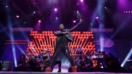 Usher performs during the Kids Inaugural: Our Children. Our Future. event in Washington, Saturday, Jan. 19, 2013. (AP Photo/Gerald Herbert)