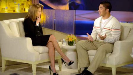 This Jan. 22, 2013 photo released by ABC shows Notre Dame linebacker Manti Teo, right, speaking with host Katie Couric during an interview for Katie, in New York. (AP Photo/Disney-ABC, Lorenzo Bevilaqua)