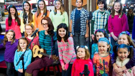 Ingrid Michaelson accompanied by children from Newtown, Conn. and Sandy Hook Elementary school perform Somewhere Over the Rainbow on ABCs Good Morning America on Tuesday, Jan. 15, 2013 in New York. (Photo by Charles Sykes/Invision/AP)