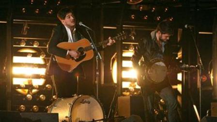 Marcus Mumford, left, and Winston Marshall, of musical group Mumford and Sons, perform at the 55th annual Grammy Awards on Sunday, Feb. 10, 2013, in Los Angeles. (Photo by John Shearer/Invision/AP)