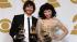 Gotye, left, and Kimbra pose backstage with the...