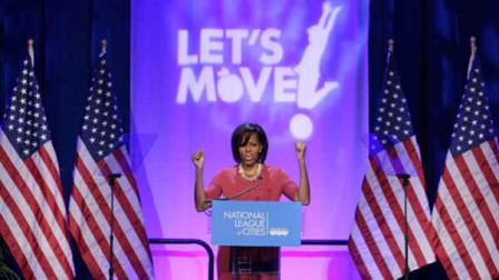 FILE - In this March 15, 2011, file photo, first lady Michelle Obama gestures while speaking speaks at the National League of Cities Conference about the Lets Move! initiative in Washington. C-SPAN has teamed up with The White House Historical Association to produce a series on first ladies. It begins with an overview Monday, Feb. 18, 2013 on Presidents Day, and continues for 35 parts until ending with an hour on Michelle Obama on Feb. 10, 2014. (AP Photo/File)