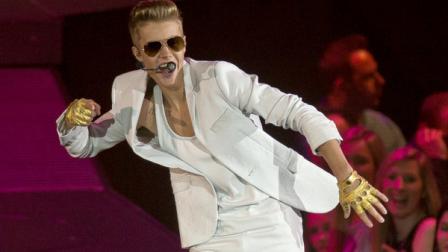 Canadian singer Justin Bieber performs at the o2 Arena in east London, Monday, Mar. 4, 2013. (Photo by Joel Ryan/Invision/AP)