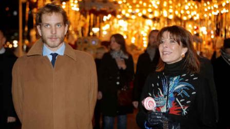 Princess Caroline of Hanover and his son Andrea Casiraghi attend the opening of the Christmas village in Monaco, Wednesday, Dec. 5, 2012. (AP Photo/Lionel Cironneau, Pool)