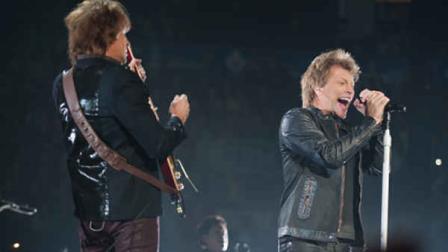 Richie Sambora, left, and Jon Bon Jovi perform on stage during their Because We Can: The Tour tour in support of their new album What About Now at the Air Canada Centre on Sunday, Feb. 17, 2013, in Toronto. (Photo by Arthur Mola/Invision/AP)