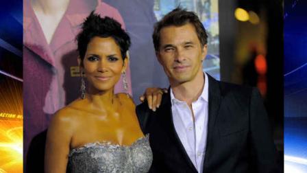 Halle Berry, a cast member in Cloud Atlas, poses with her fiance Olivier Martinez at the premiere of the film at Graumans Chinese Theatre on Wednesday, Oct. 24, 2012, in Los Angeles. (Photo by Chris Pizzello/Invision/AP)