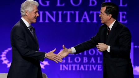 Former President Bill Clinton and Comedy Centrals Stephen Colbert, right, shake hands before an interview during the Clinton Global Initiative at Washington University Saturday, April 6, 2013, in St. Louis. More than 1,000 university students from 75 countries and all 50 states are gathered for a weekend of sessions seeking practical and innovative solutions to the worlds problems. (AP Photo/Jeff Roberson)