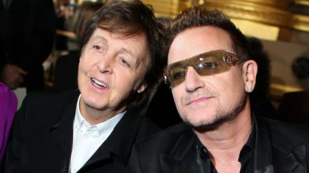 Sir Paul McCartney and Bono pose for photographers prior to fashion designer Stella McCartneys Fall/Winter 2013-2014 ready to wear collection, in Paris, Monday, March, 4, 2013. (AP Photo/Thibault Camus)
